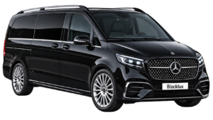 Black Mercedes-Benz V-Class shown from the front three-quarter view with a Blacklux plate